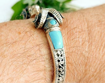 Turquoise cuff bracelet with ram heads in sterling silver 925