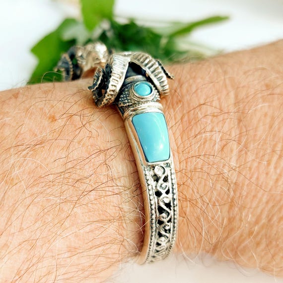 Turquoise cuff bracelet with ram heads in sterling silver 925