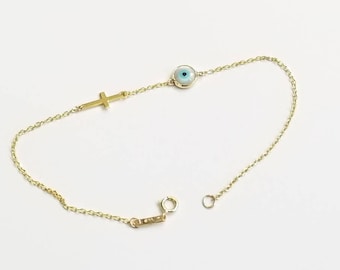 Round evil eye bracelet in k14 solid gold with off centre cross.