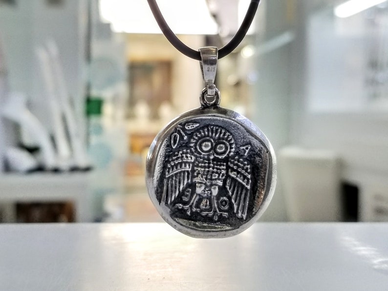 Athena the Goddess replica coin in sterling silver 925. A silver coin pendant with Goddess Athena on one side and Athena owl (with wings open) on the other.
