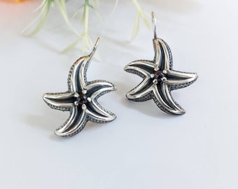 Silver starfish earrings with garnets, marine-life jewelry