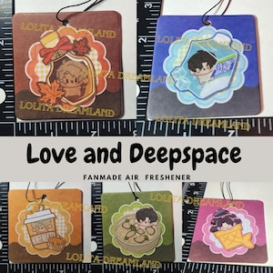 May include: A collection of five square air fresheners with cartoon illustrations. Each features a different design, including a maple syrup bottle, a carton of coconut water, a cup of honey milk, a bowl of food, and an ice cream cone. The text "Love and Deepspace" is visible.