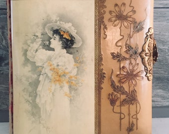 possibly Brundage Victorian Celluloid Photo Album depicting an Adorable Girl holding Her Kitten