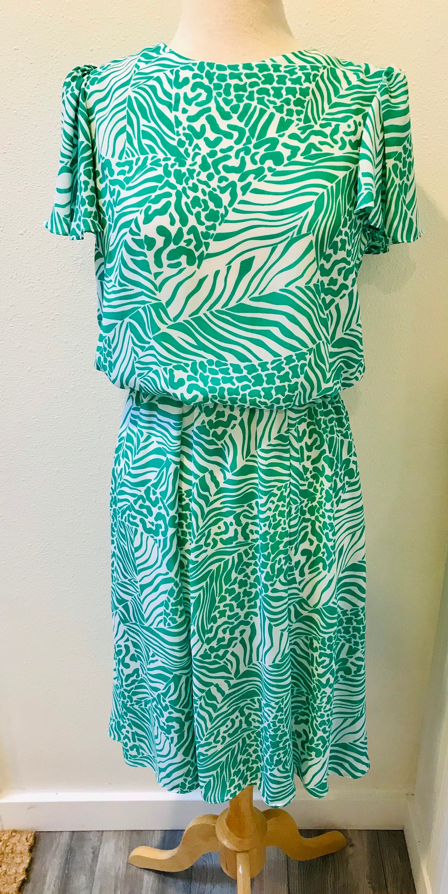 green and white zebra print dress Dark Green Dress with Leopard Print Accents – Sportin It Boutique main image 0