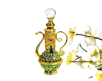 May include: A gold and green decorative bottle with a crystal stopper. The bottle is shaped like a traditional Middle Eastern oil lamp and has intricate details.