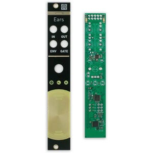 May include: A black and gold electronic module labeled "Ears" with multiple input/output ports and a green circuit board. The module has a circular design at the bottom and is designed for audio applications.
