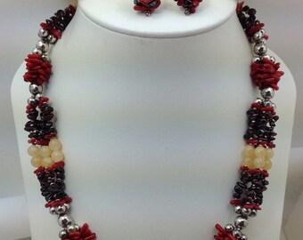 4 strand necklace made of coral, silver, garnet, and citrine beads. With matching earrings