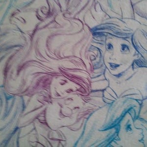 May include: A drawing of two mermaids with long flowing hair. One mermaid has purple hair and the other has blue hair. The mermaids are drawn in a whimsical style with soft lines and shading.
