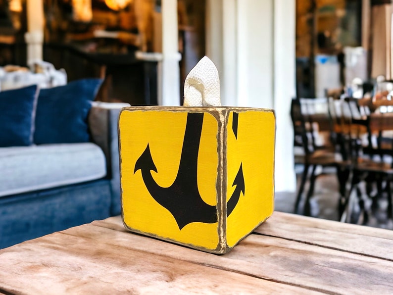 Coastal Anchor Tissue Box Cover in a nautical-themed beach cottage or vacation rental, featuring hand-painted anchor design for coastal décor, beach cottages, vacation homes, or seaside cabins, ideal for bedrooms, bathrooms, or living spaces, handmade in Maine