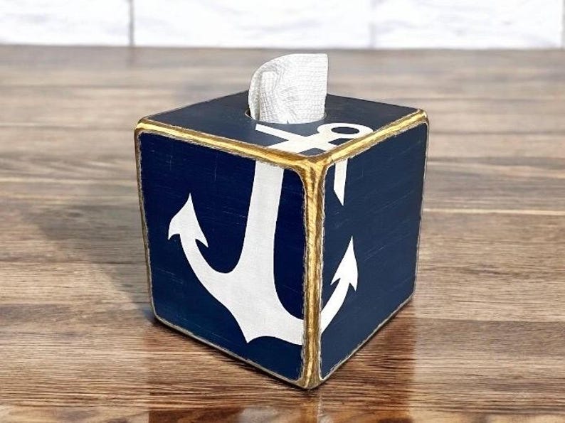 Coastal Anchor Tissue Box Covers styled in a nautical-themed coastal living space, featuring hand-painted anchor designs for beach cottages, vacation homes, seaside cabins, or short-term rental décor, adding rustic coastal charm to bedrooms, bathrooms, or living areas