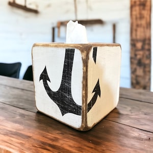 Coastal Anchor Tissue Box Cover with hand-painted nautical anchor design, ideal for beach cottages, coastal vacation homes, nautical décor, short-term rental interiors, or seaside cabins, rustic hand-painted tissue box cover