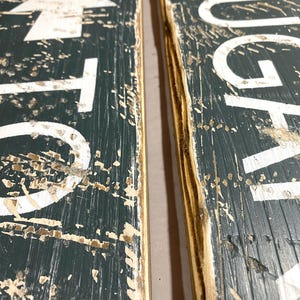Close-up of the hand-distressed edges on the Cider Mill wood sign, highlighting weathered craftsmanship, natural wood texture, and the authentic vintage character of each handcrafted piece