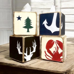 Anchor Tissue Box Covers displayed together in a nautical-themed vacation home, featuring hand-painted anchor design for beach cottages, coastal vacation homes, seaside cabins, or short-term rentals, ideal for bathroom, bedroom, or living space styling