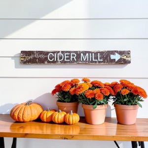 Handcrafted Cider Mill wood sign displayed in a cozy farmhouse surrounded by pumpkins and autumn decor, bringing the charm of apple orchards, fall harvest traditions, rustic country living, and vintage farmhouse style into your home