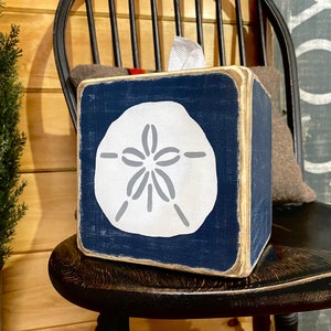 Sand dollar coastal tissue box cover with weathered beach house style, distressed wood finish inspired by salt, sand, and ocean living, perfect for beach house bathrooms, coastal cottages, lake homes, and vacation rentals, relaxed seaside decor handmade in Maine