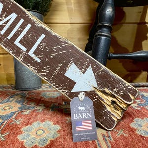 Close-up of the handcrafted Cider Mill wood sign featuring detailed hand-painted lettering, natural wood grain, layered paint, and weathered distressing that gives each sign authentic vintage farmhouse character.