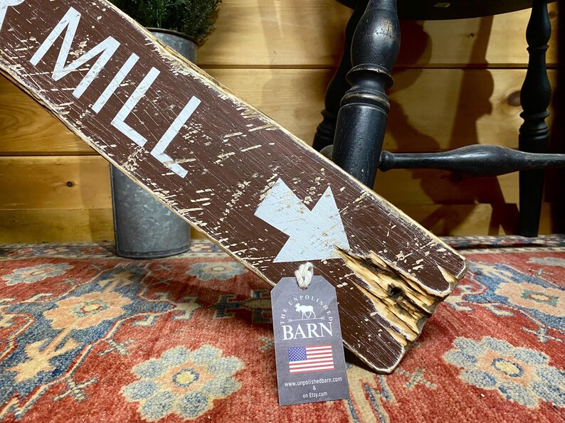 Close-up of the handcrafted Cider Mill wood sign featuring detailed hand-painted lettering, natural wood grain, layered paint, and weathered distressing that gives each sign authentic vintage farmhouse character.