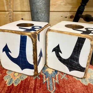 Two Coastal Anchor Tissue Box Covers displayed together, hand-painted with nautical anchor designs, perfect for beach cottages, coastal vacation homes, seaside cabins, or short-term rental interiors, rustic hand-crafted tissue box covers