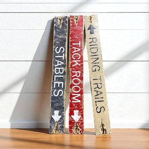 Group display of the Tack Room Sign Set in a barn, ranch home, or rustic cabin, highlighting all three hand-distressed signs. Perfect for tack rooms, stables, riding trails, vacation rentals, cabins, and lodge interiors, emphasizing Western character, authentic handcrafted style, and horse-themed décor