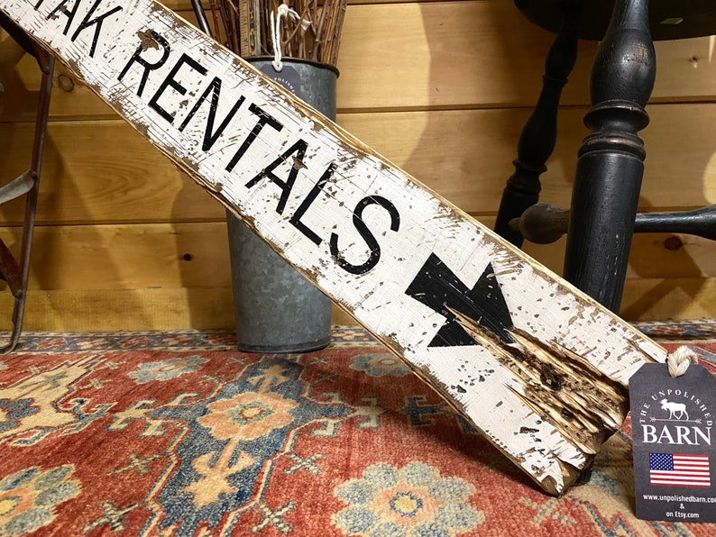 Close-up of lettering on Kayak Rentals wood sign, highlighting detailed craftsmanship and rustic finish for vacation rentals, cabins, lodges, camps, and coastal homes