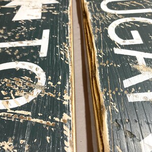 Edge detail close-up of Kayak Rentals wood sign showing worn corners and natural rustic wood finish, perfect for short term rentals, beach houses, cabins, lodges, and camps