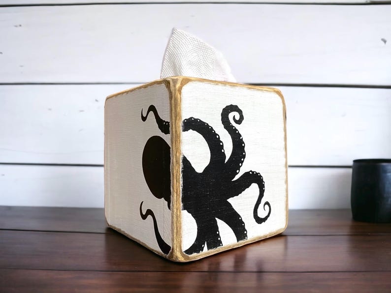 Handcrafted octopus tissue box cover featuring a detailed coastal octopus design with a vintage distressed finish. Nautical bathroom decor for beach houses, coastal cottages, lake houses, vacation homes, and seaside-inspired interiors