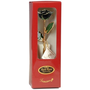 May include: A single black rose dipped in 24k gold, presented in a red box with a gold label that reads "Real Rose Dipped in 24k Gold" and "Living Gold".