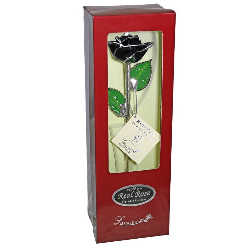 May include: A single black rose dipped in platinum, presented in a red box with a gold label that reads "Real Rose Dipped in Platinum" and "Living Gold".