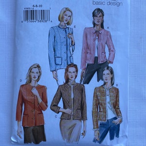May include: A Vogue basic design sewing pattern envelope labeled V7975 for sizes 6-8-10. The front features illustrations of five different jacket styles labeled A, B, C, D, and E, showcasing various textures, colors, and front closures including buttons and ties.