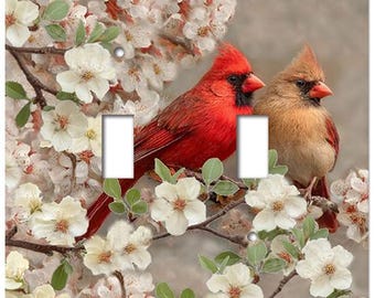 This light switch plate features a male and female cardinal in a dogwood tree.  One of our top selling bird switchplate covers. AB197