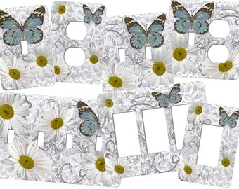 Butterfly Switch Plate Cover featuring a gorgeous blue butterfly with daisies.  This design is available out to four switches FG289