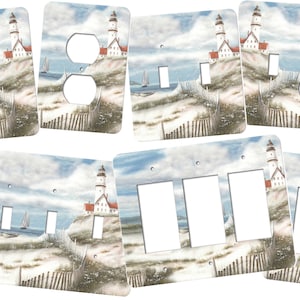 May include: A set of light switch and outlet covers featuring a coastal scene with a lighthouse on a sandy beach. The covers are available in various sizes and configurations, including single, double, and triple switch plates.