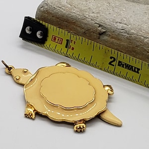 Vintage gold and cream turtle pendant