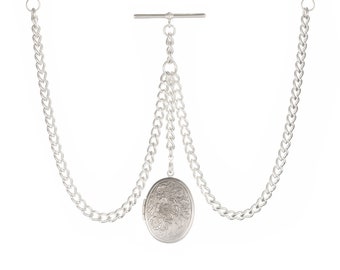 May include: Silver pocket watch chain with a decorative oval locket. The chain has two clasps and a T-bar connector.
