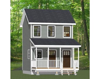 May include: A two-story house with a gray exterior, black roof, and white trim. The house has a small porch with a white railing and two brown doors. Windows are framed in white. The house is surrounded by trees.