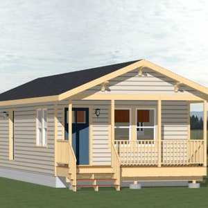 May include: A small, light beige house with a covered porch and a blue front door. The house has a gabled roof and a wooden deck with railings.