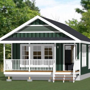 May include: A small, green, wooden house with a white porch and a white door. The house has a white roof and white trim. The house is surrounded by green grass and trees.