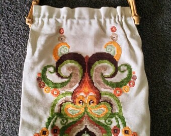 Hand worked 1970s embroidered handbag with bamboo handles.