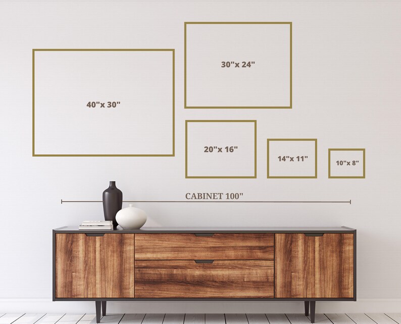 May include: A wooden cabinet with a dark finish, featuring two drawers and doors, is positioned below a series of framed art pieces. The frames are in varying sizes, including 40" x 30", 30" x 24", 20" x 16", 14" x 11", and 10" x 8". The text "CABINET 100" is also present.