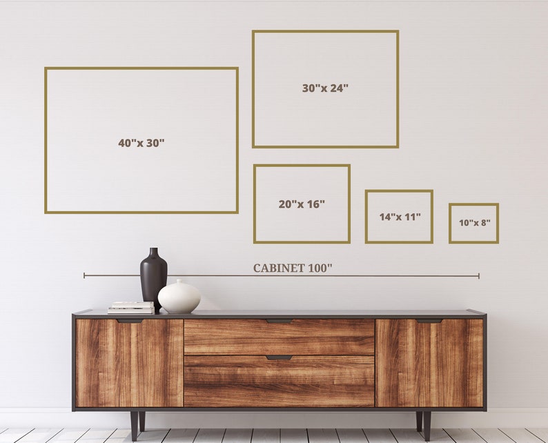 May include: A wooden cabinet with a dark finish, featuring two drawers and doors. Above the cabinet, five framed rectangles of varying sizes are displayed on a white wall. The largest frame is 40" x 30", and the smallest is 10" x 8". The text "CABINET 100" is also present.