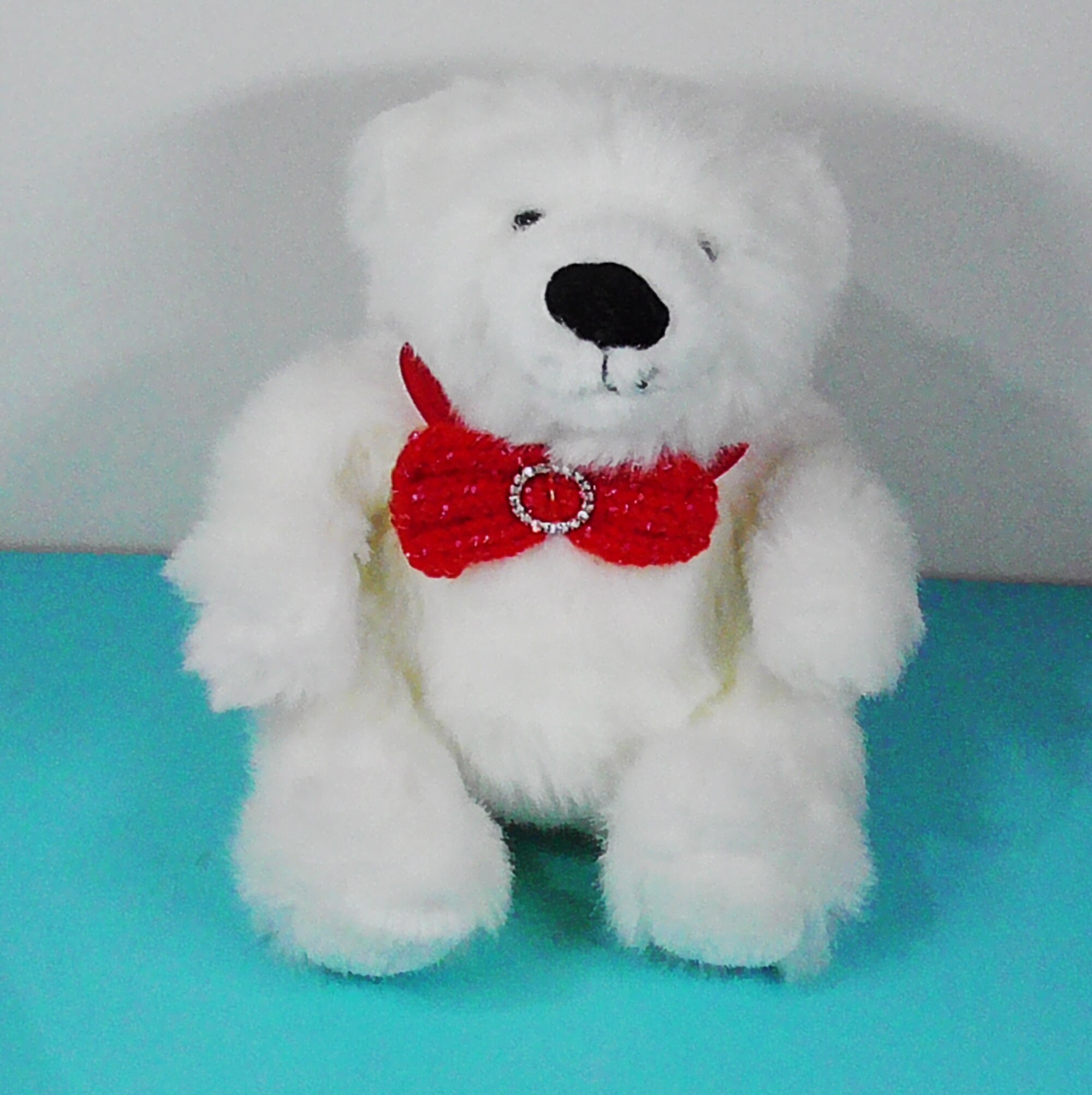 teddy bear with purple bow tie