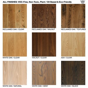 May include: A selection of wood flooring samples in various colours and finishes, including reclaimed oak, white oak, walnut, and ash. The finishes include clear, walnut, textured, natural, grey, and black.