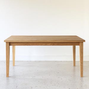 Slim Tapered Leg Dining Table Pictured In White Oak Clear