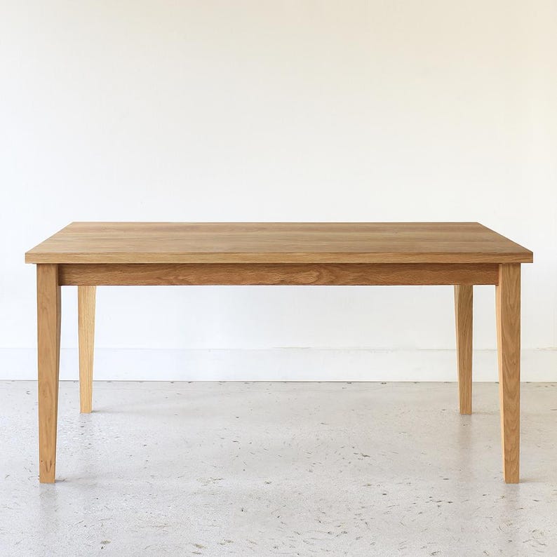 Slim Tapered Leg Dining Table Pictured In White Oak Clear