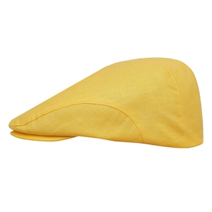 May include: A yellow linen flat cap with a slightly curved brim.
