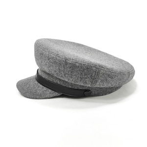 May include: A gray wool captain's hat with a black leather band. The hat has a short brim and a rounded crown. This classic style hat is suitable for various occasions.