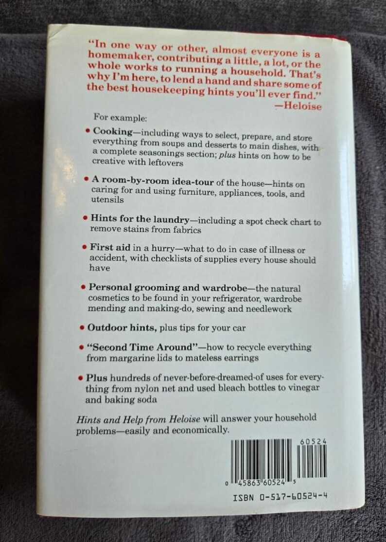 May include: A vintage paperback book titled "Hints and Help from Heloise." The cover features a list of household tips, including cooking, laundry, and first aid. The book's ISBN is 0-517-60524-4.
