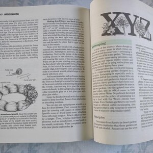 May include: A book open to two pages with text and illustrations about wreath making and xeriscaping. The left page shows a diagram of a straw wreath with floral wire and a floral pick. The right page shows the letters X, Y, and Z made of green leaves and flowers.