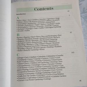 May include: A book titled "Contents" with a table of contents listing various plants and gardening topics. The table of contents is organized alphabetically by letter and includes topics such as "Bees and Beekeeping", "Gardening", "Bonsai", "Budding", and "Cut Flower Gardening".