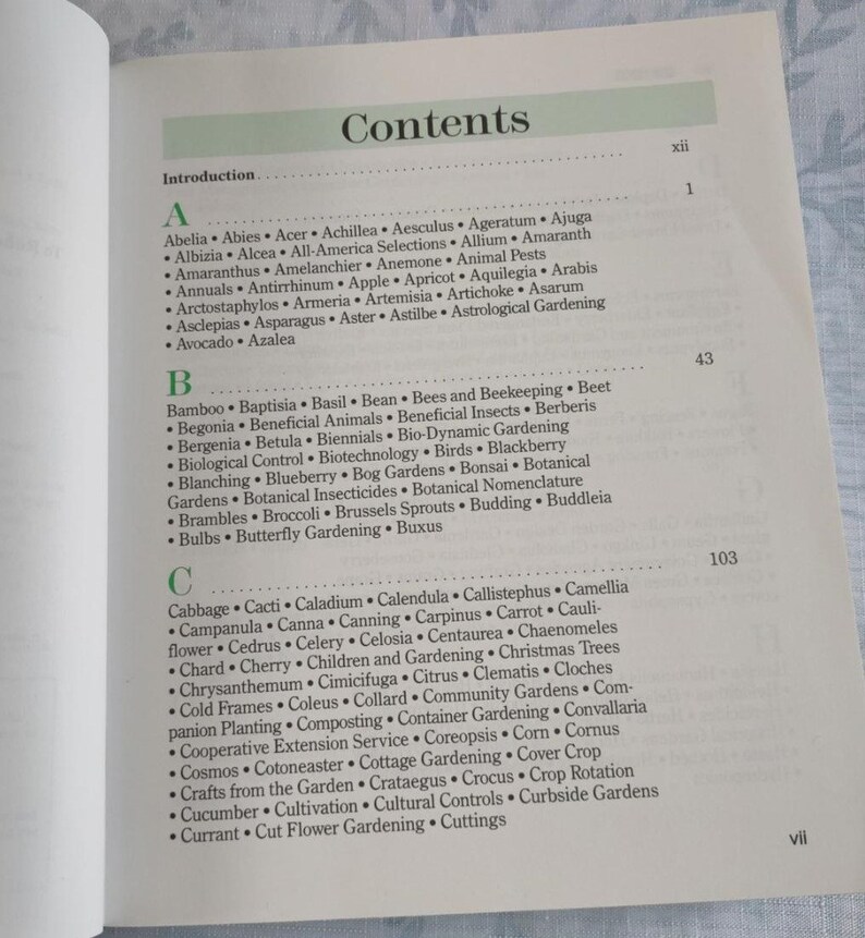 May include: A book titled "Contents" with a table of contents listing various plants and gardening topics. The table of contents is organized alphabetically by letter and includes topics such as "Bees and Beekeeping", "Gardening", "Bonsai", "Budding", and "Cut Flower Gardening".
